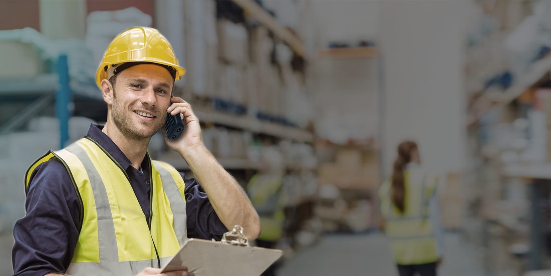 Warehouse worker taking a call on a Yealink W57R handset